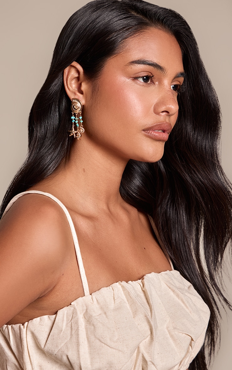 Boucles d'oreilles drapées dorées à perles turquoise et coquillage