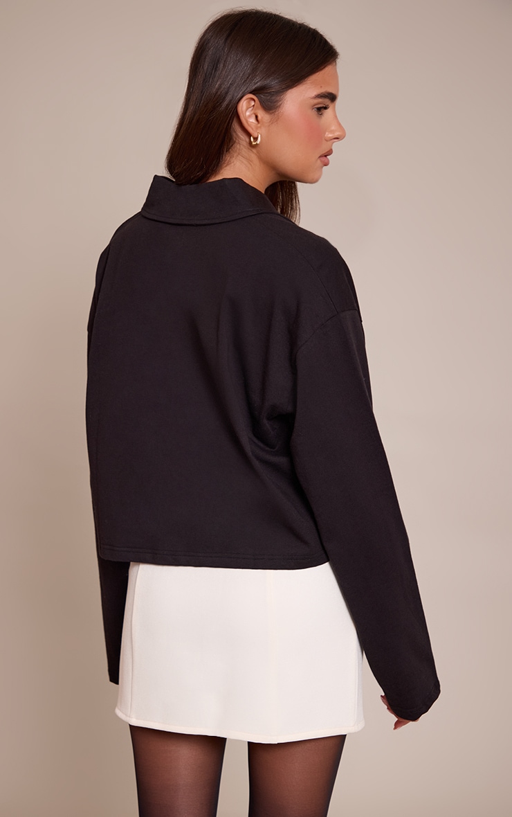 Crop top en coton noir à col polo et manches longues image 2