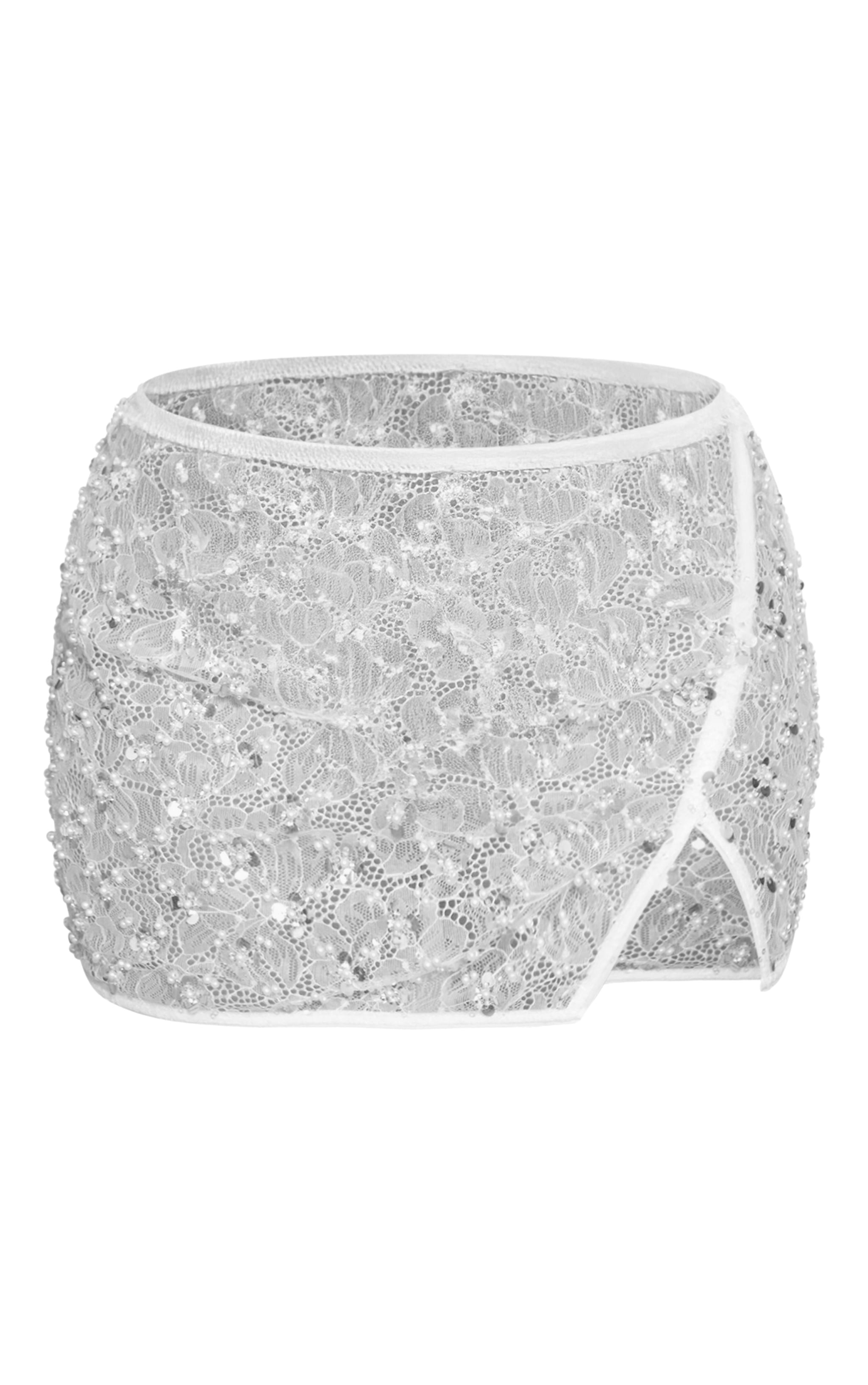 Petite Mini-jupe blanche fendue sur le côté à ornements image 6