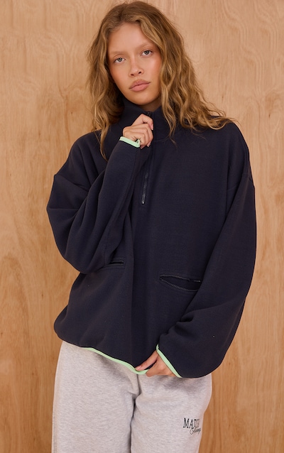 Polaire bleu marine détail poches à quart de zip