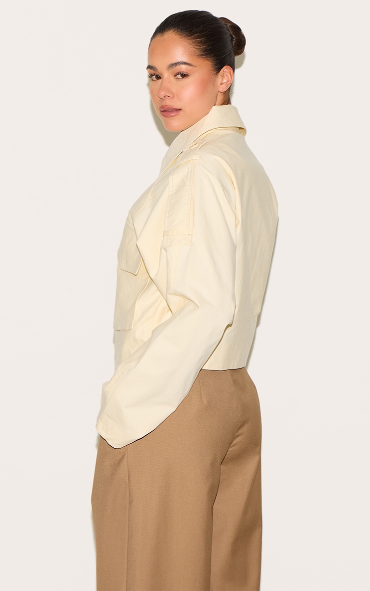 Veste courte crème au beurre à détails trench et zip image 2