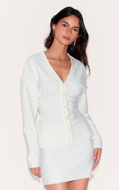 Cardigan de tailleur crème à agrafes et oeillets