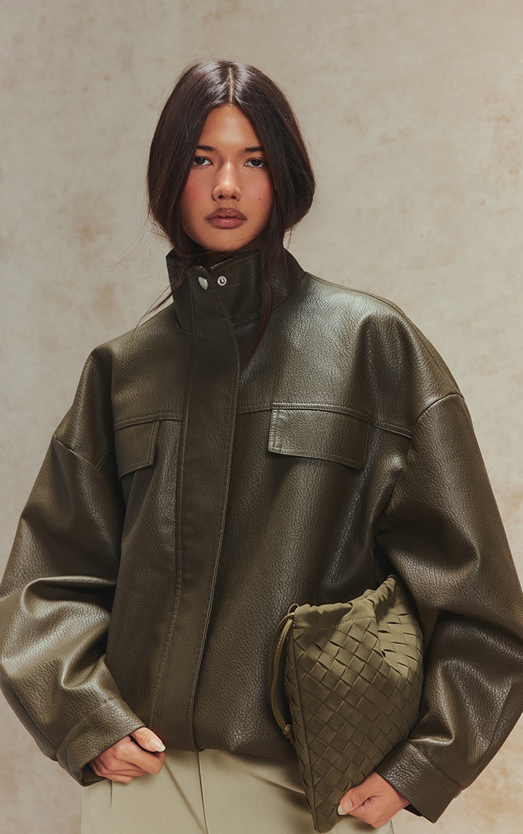 Veste en PU kaki à col entonnoir et boutons cachés image 1