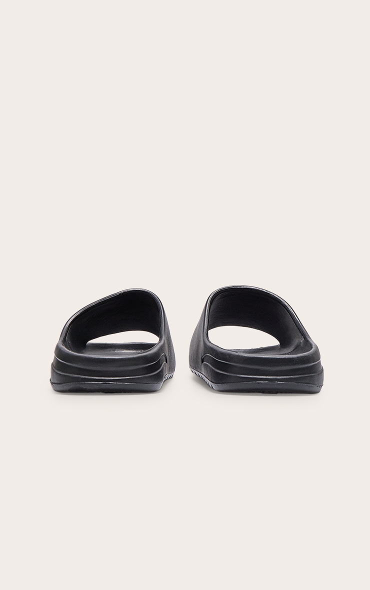 Claquettes noires en caoutchouc à semelle crantée image 4