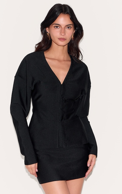 Cardigan de tailleur noir profond à agrafes et oeillets
