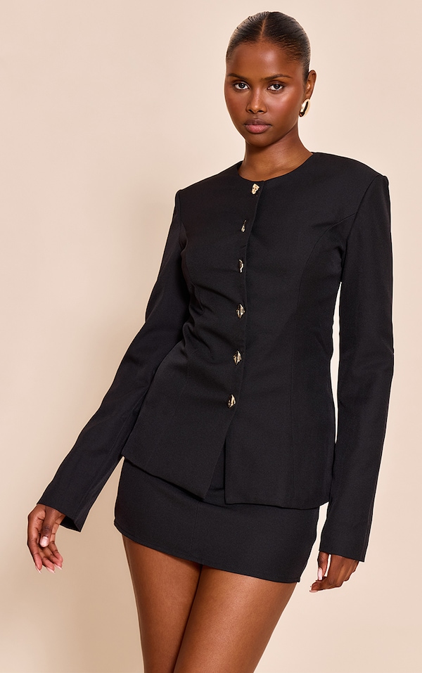 Chemise noire à empiècements et taille cintrée