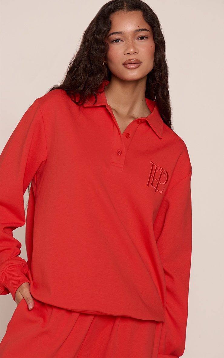 Red Embroidered Interlock Button Polo Sweatshirt