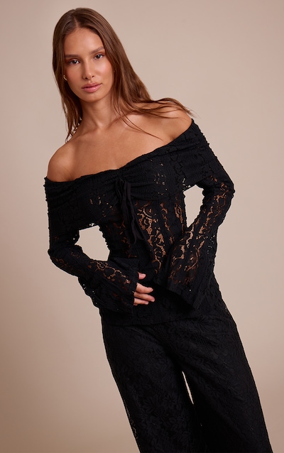 Top ajusté en dentelle noire à col bardot et manches évasées