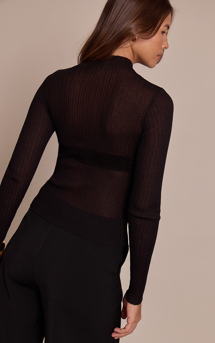 Top en maille tricot noire transparente à col montant et manches longues image 2