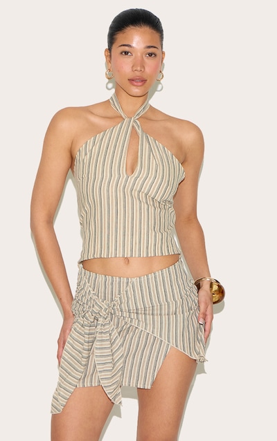 Top beige à rayures et découpe goutte d'eau