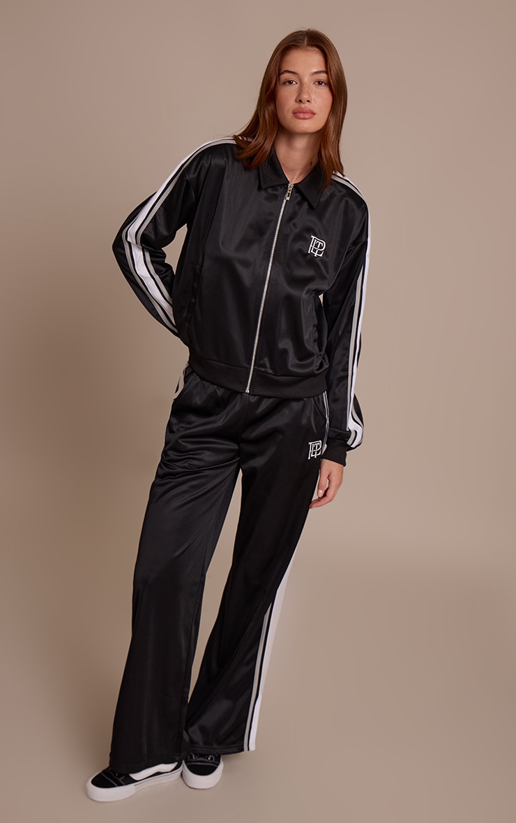Veste noire à zip et rayures contrastantes sur les côtés image 3