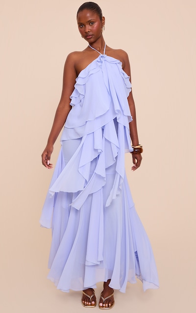Robe longue fluide en mousseline de soie bleu clair à dos nu et volants