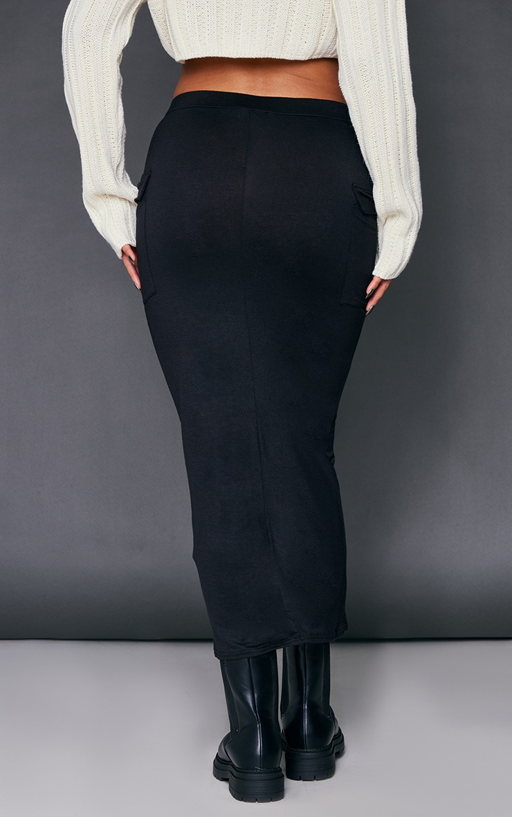 Jupe mi-longue en jersey noir à poches et taille en V image 3