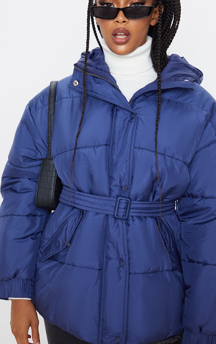 navy belted puffer coat