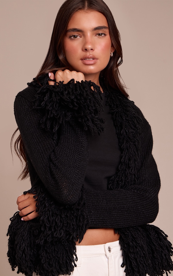 Cardigan en maille tricot noire à bordures bouclées