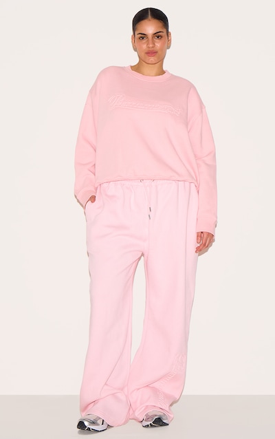 PRETTYLITTLETHING Plus Jogging droit rose tendre à graphique en relief