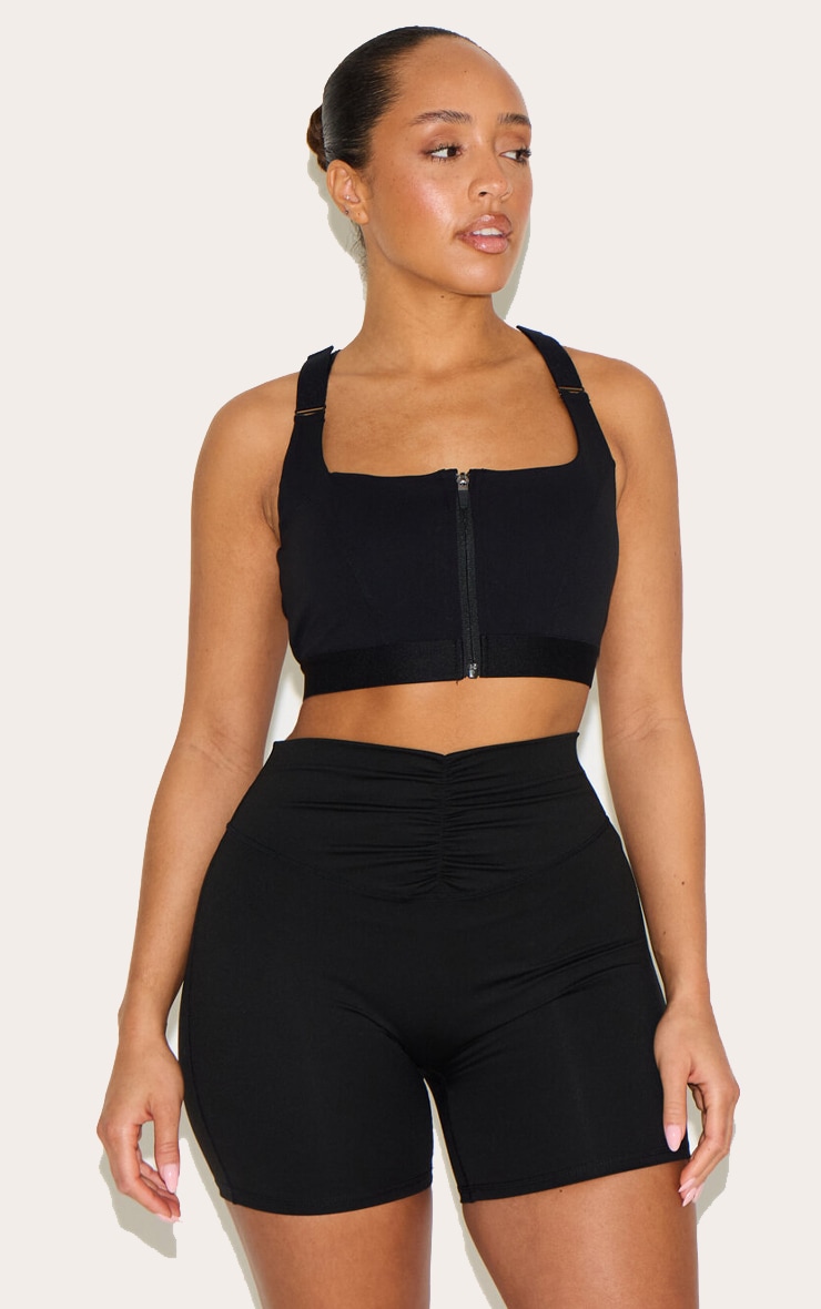 Shape Brassière de sport rembourrée noire à bretelles ajustables et zip devant image 1