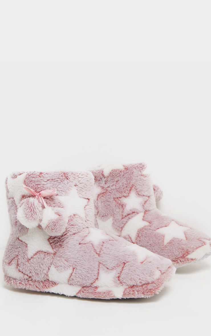 Chaussons roses style bottes à étoiles