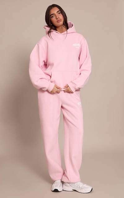 Jogging sweat rose tendre imprimé "PLT Sports Club" à ourlets resserrés