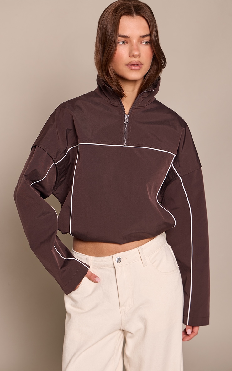 Veste coupe-vent chocolat à zip et lisérés contrastants