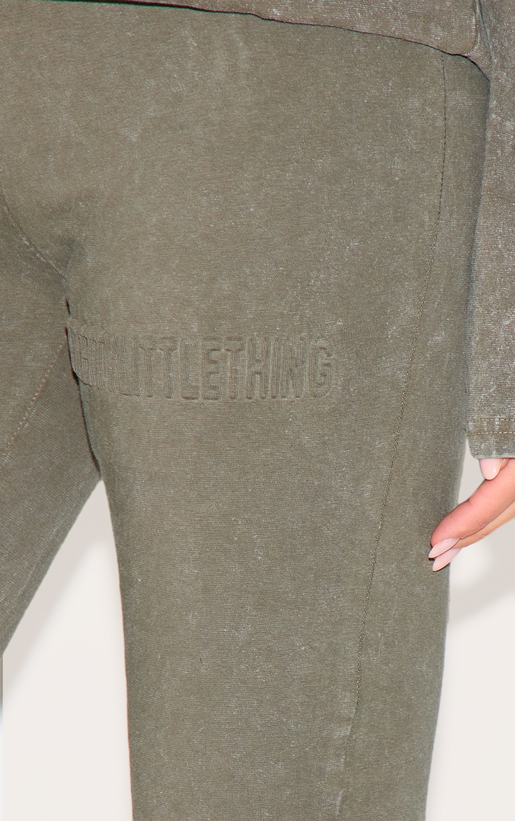 PRETTYLITTLETHING Olive Embossed Logo Washed Skinny Flare Pant image 4