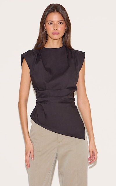 Top long tissé noir à détails sur les épaules et ourlet asymétrique