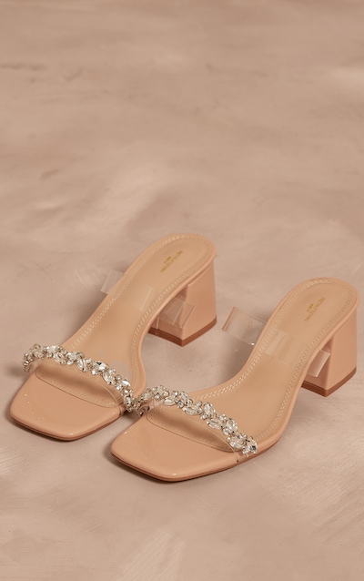 Mules à talon carré en PU nude à bout carré large et bride transparente avec détail bijoux