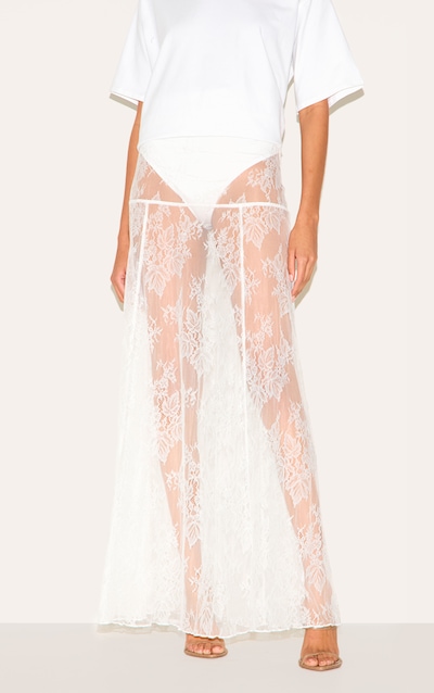 Jupe longue en dentelle blanche fleurie transparente à culotte intégrée