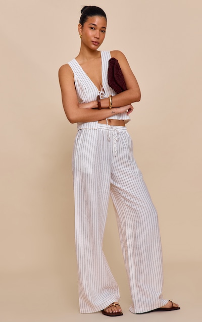 Pantalon large crème à fines rayures et cordons ajustables