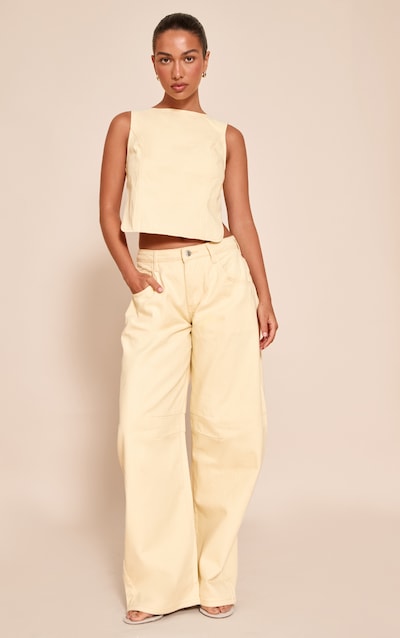 Jean style bouffant crème au beurre à taille basse et coutures devant