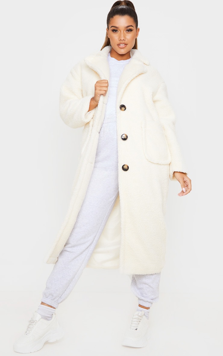 Manteau long crème en faux-mouton