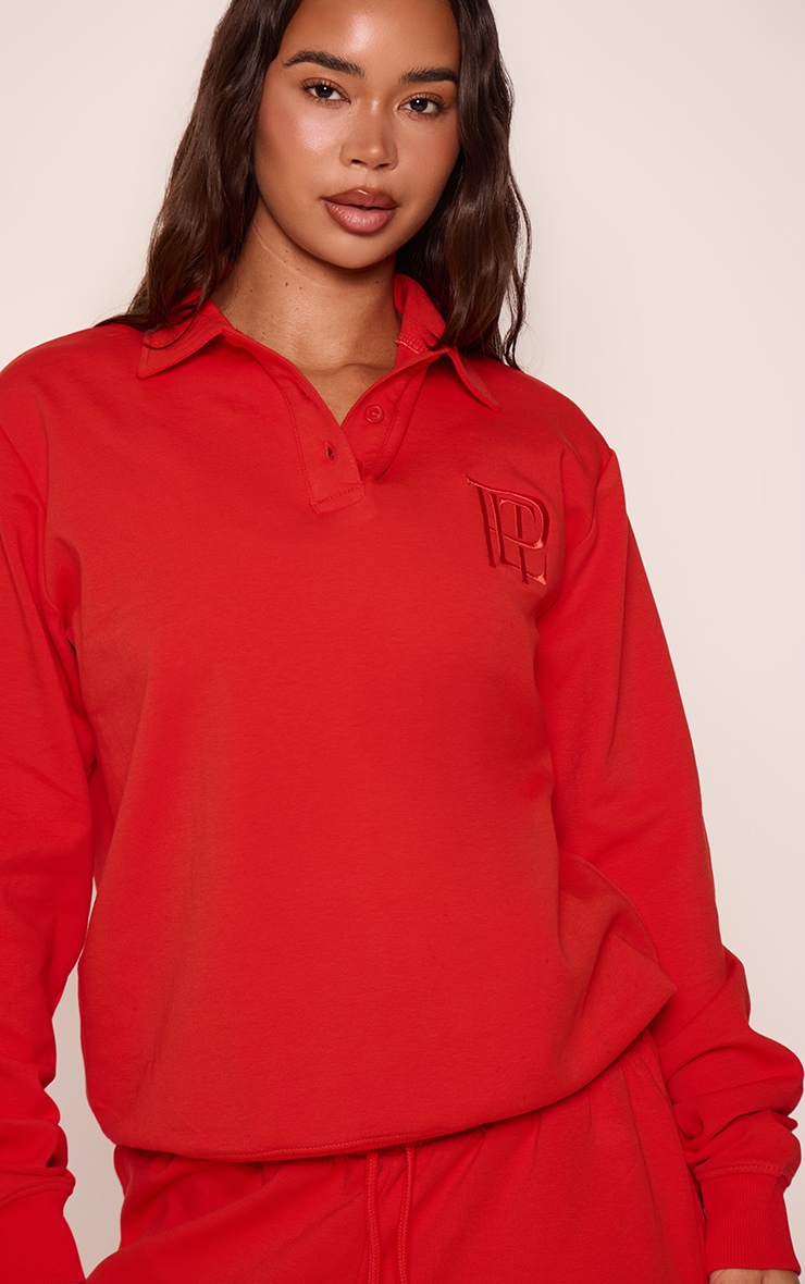 Red Embroidered Interlock Button Polo Sweatshirt
