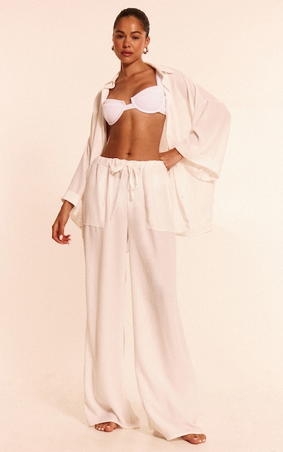 Pantalon de plage fluide en effet lin blanc à cordons ajustables