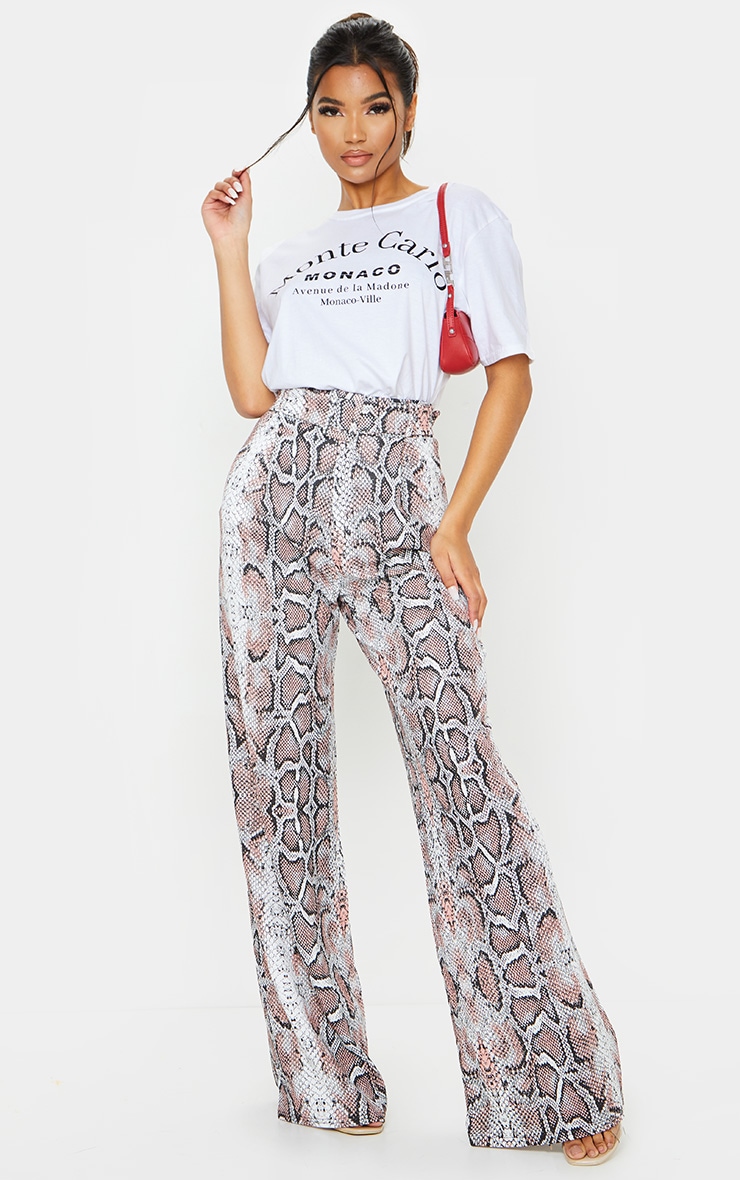 Pantalon jambes évasées serpent blanc à ceinture