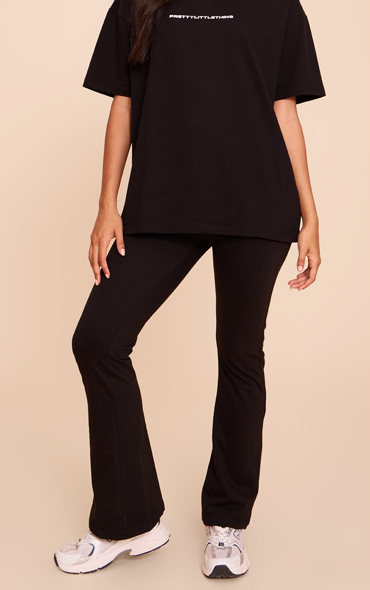 PRETTYLITTLETHING Black Printed Flared Pants image 2