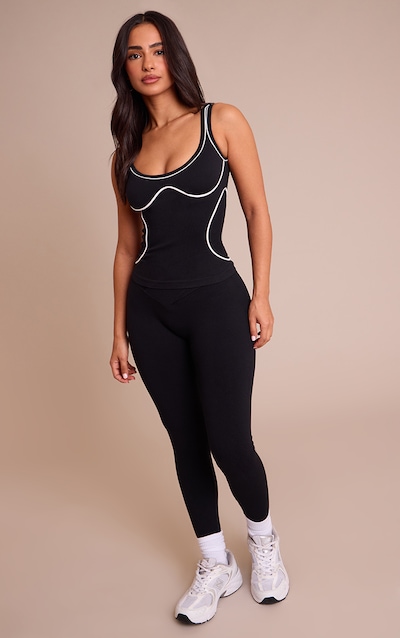 Legging noir en maille tricot chinée sans coutures à devant croisé coupe petite