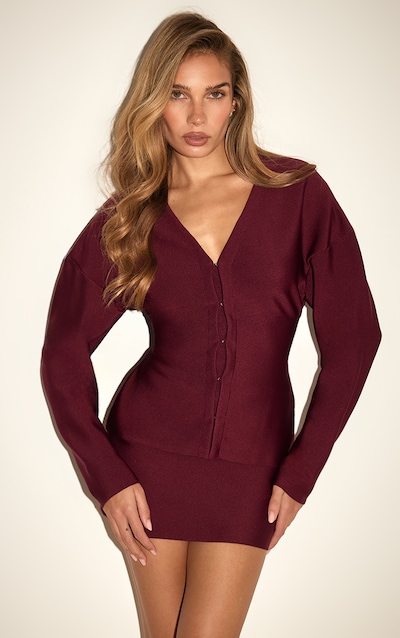 Cardigan de tailleur bordeaux à agrafes et œillets