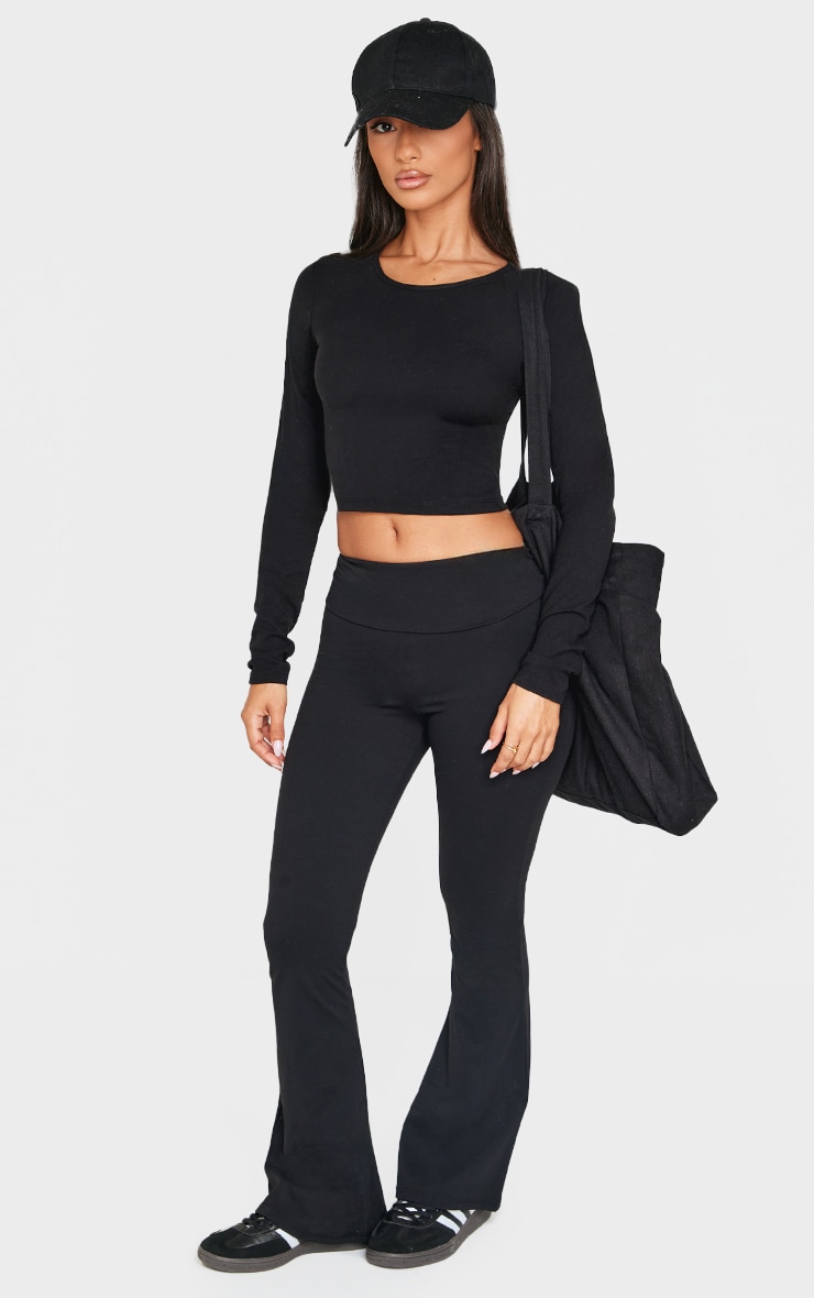 Petite Top Sculpt noir à contours et manches longues image 3