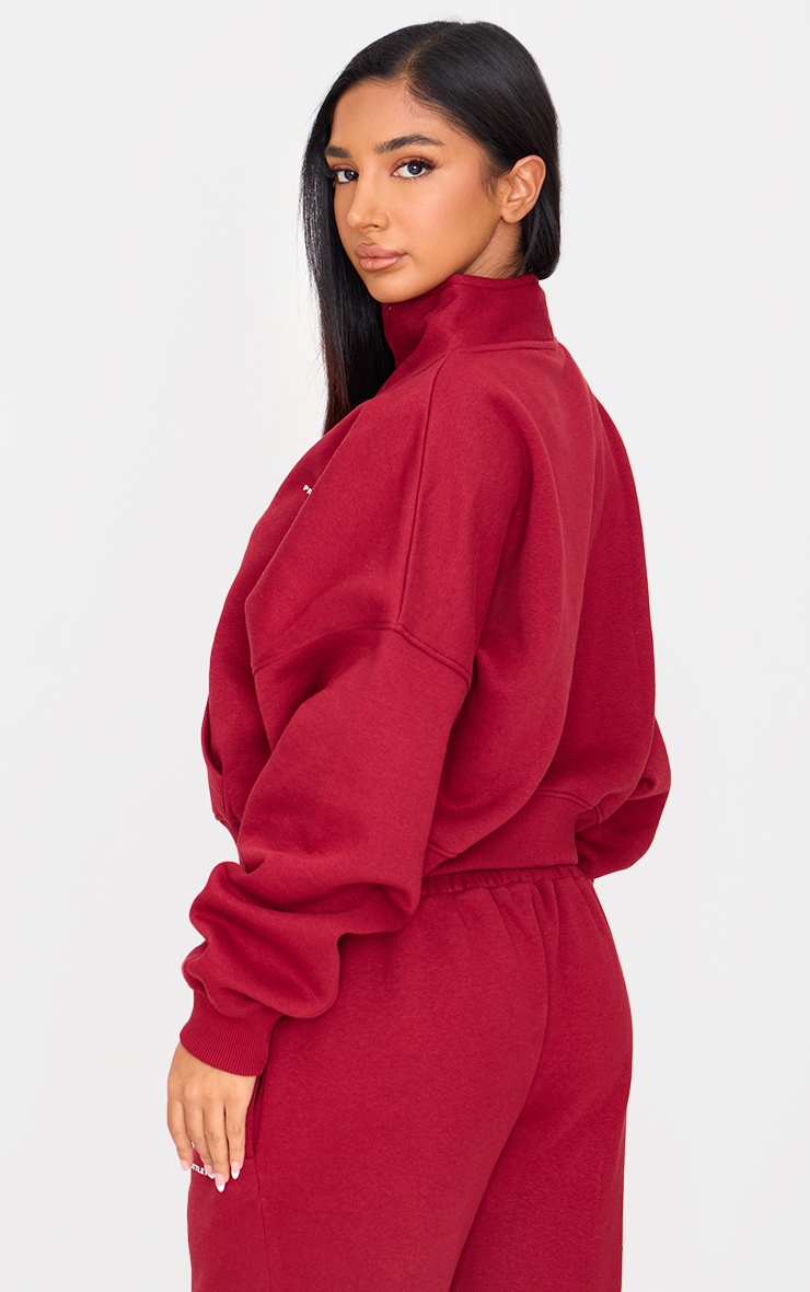Petite Sweat oversize bordeaux à demi-zip et slogan image 2