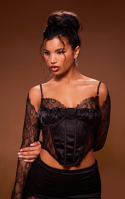 Corset en dentelle noire à empiècement satiné et manches