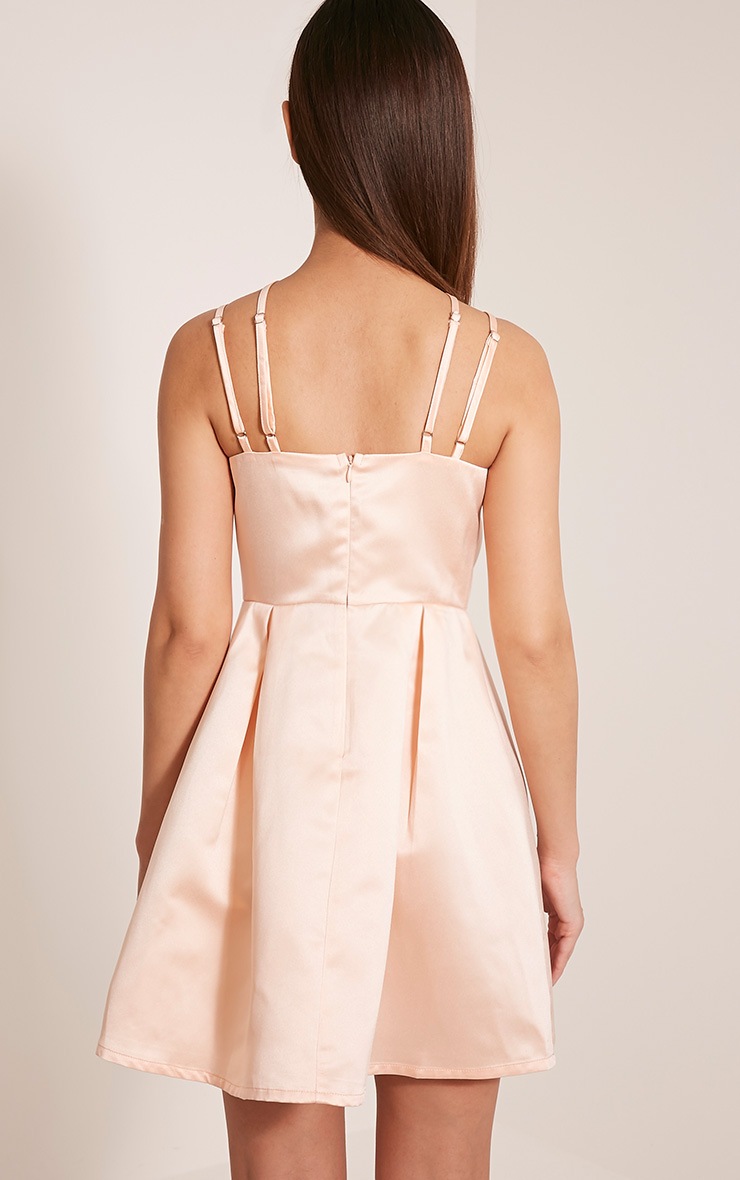 blush dress with an open back and strappy straps