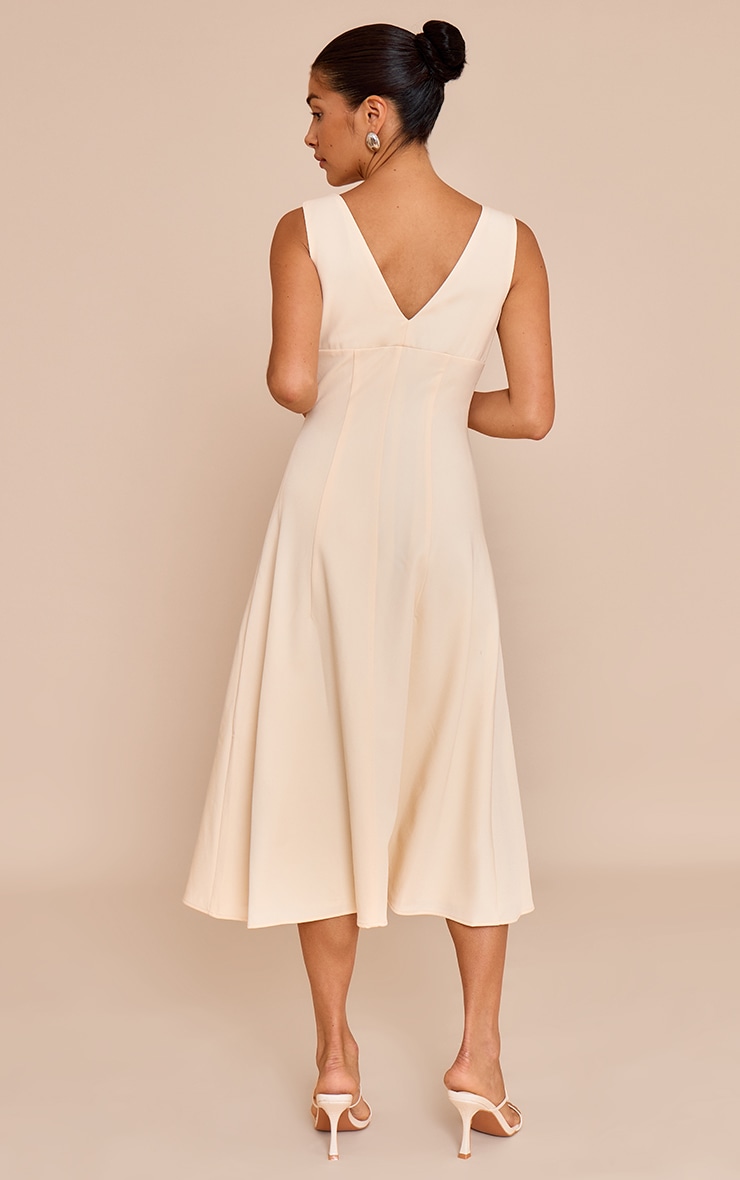 Petite Robe mi-longue crème au beurre à décolleté et boutons image 2