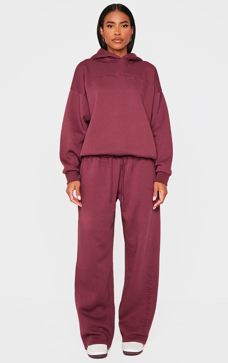 PRETTYLITTLETHING Burgundy Athletics Club Embossed Straight Leg Track Pants image 1