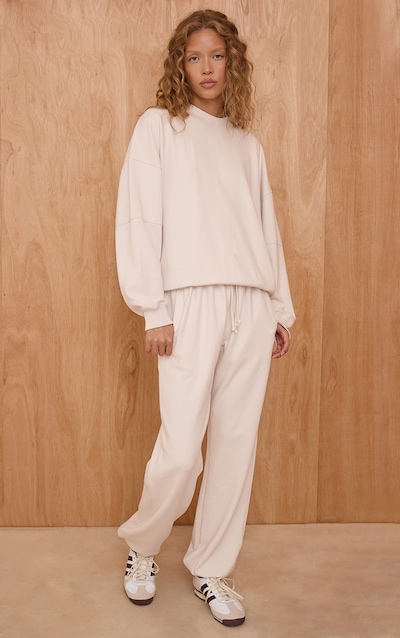 Jogging tissé crème à ourlets resserrés