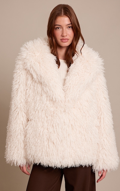 Manteau mi-long en fausse fourrure de Mongolie crème