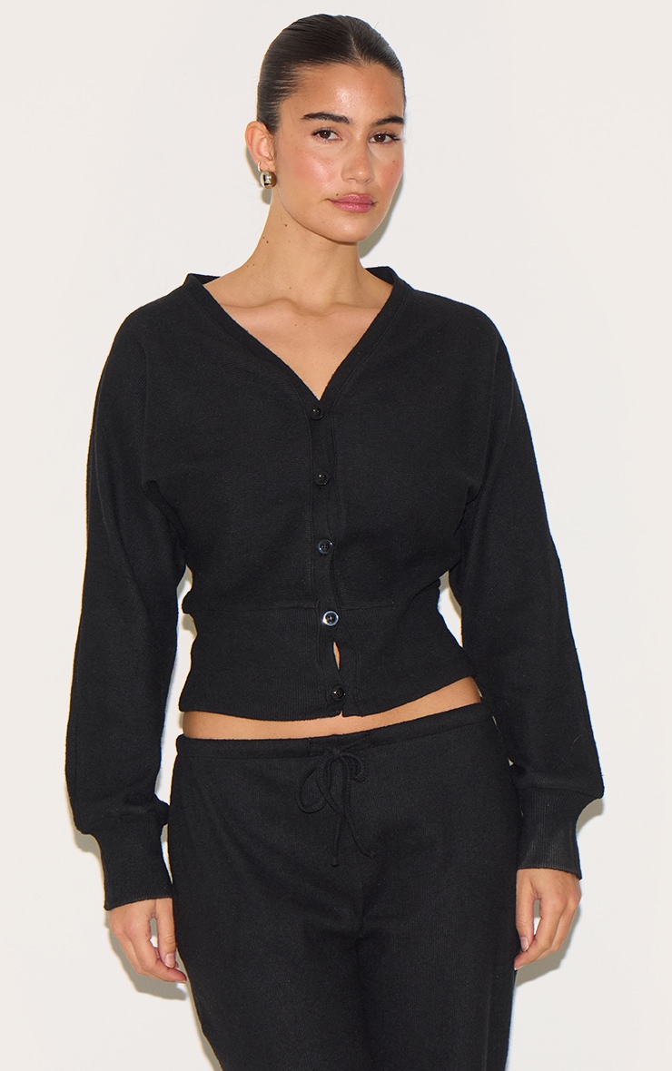 Cardigan côtelé doux noir à boutons image 1