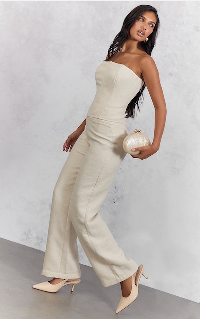 Pantalon bouclé blanc à taille basse et coupe droite