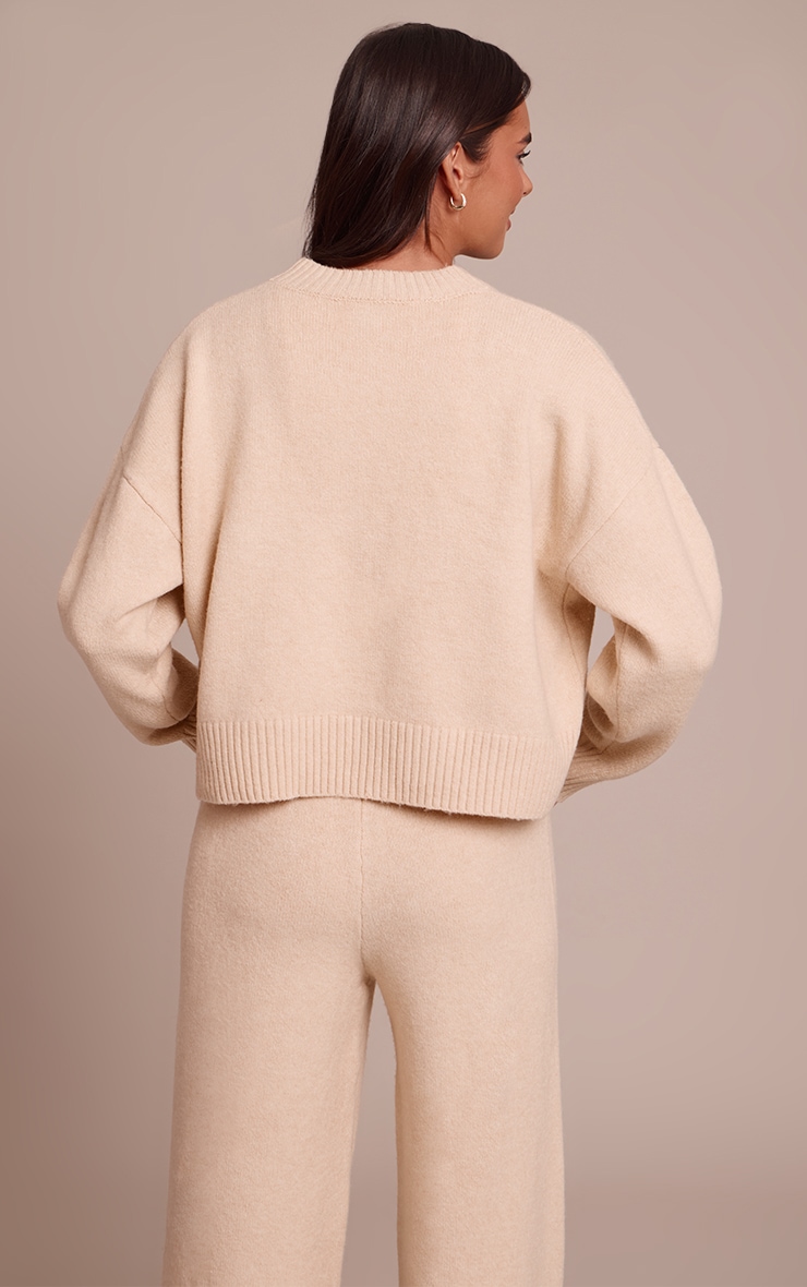 Pull court en maille tricot beige chiné à col ras image 2