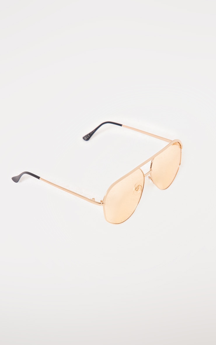 Lunettes de soleil style aviateur à lentilles oranges et barre dorée image 2