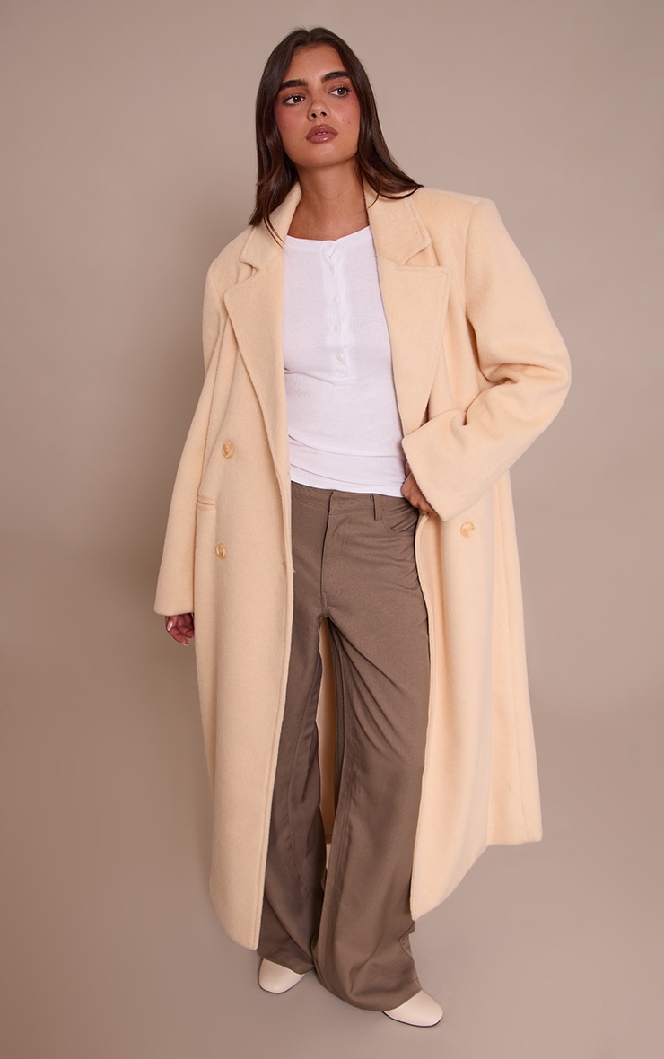 Manteau long structuré en effet laine crème au beurre à double boutonnière image 1